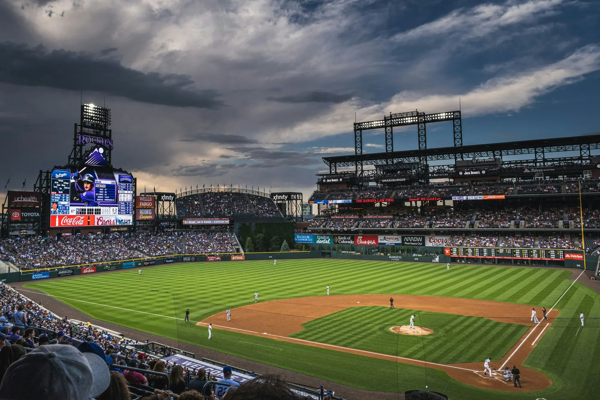 Coors Field under the lights at dusk