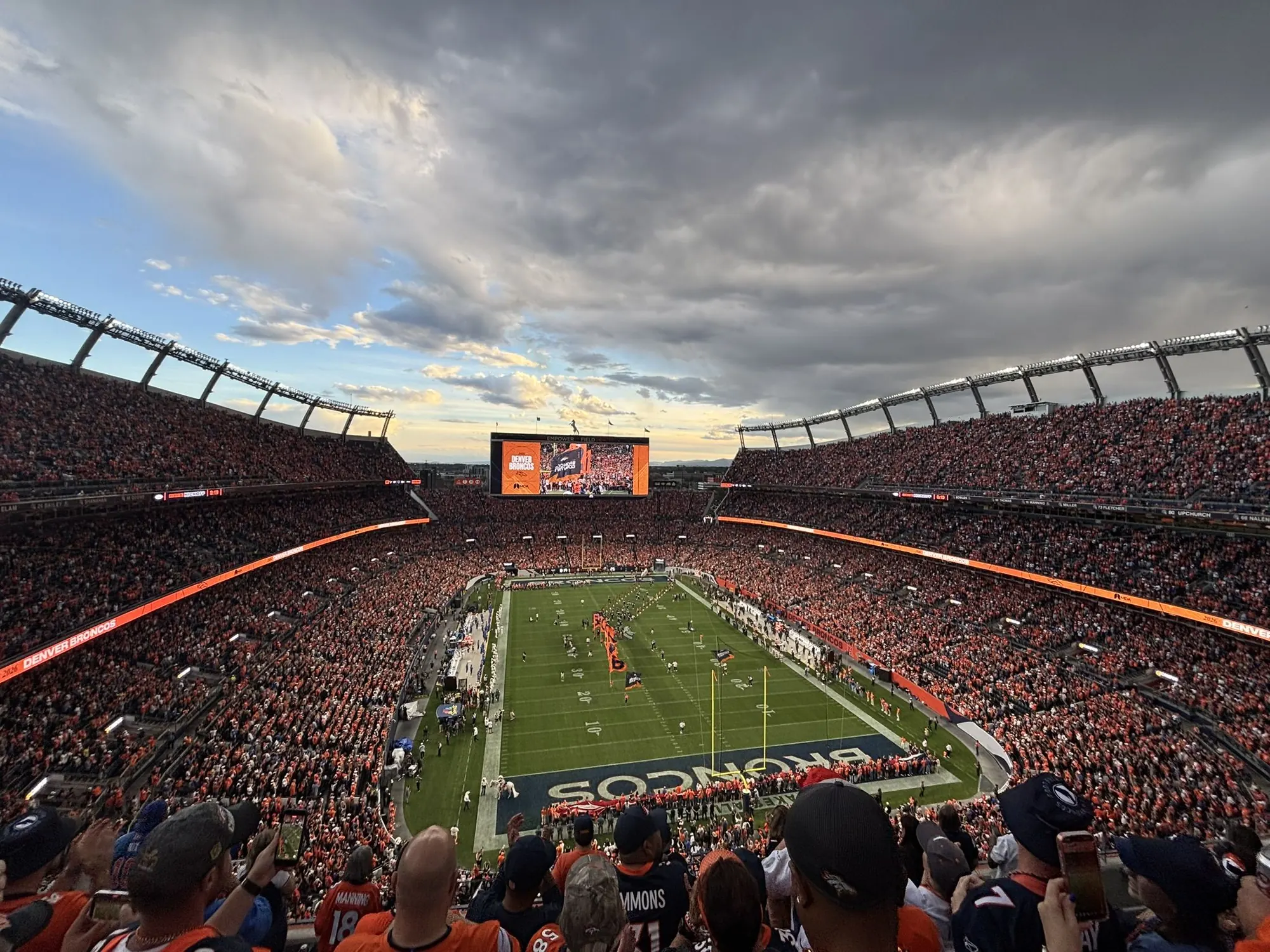 Sunset over a packed Empower Field at Mile High